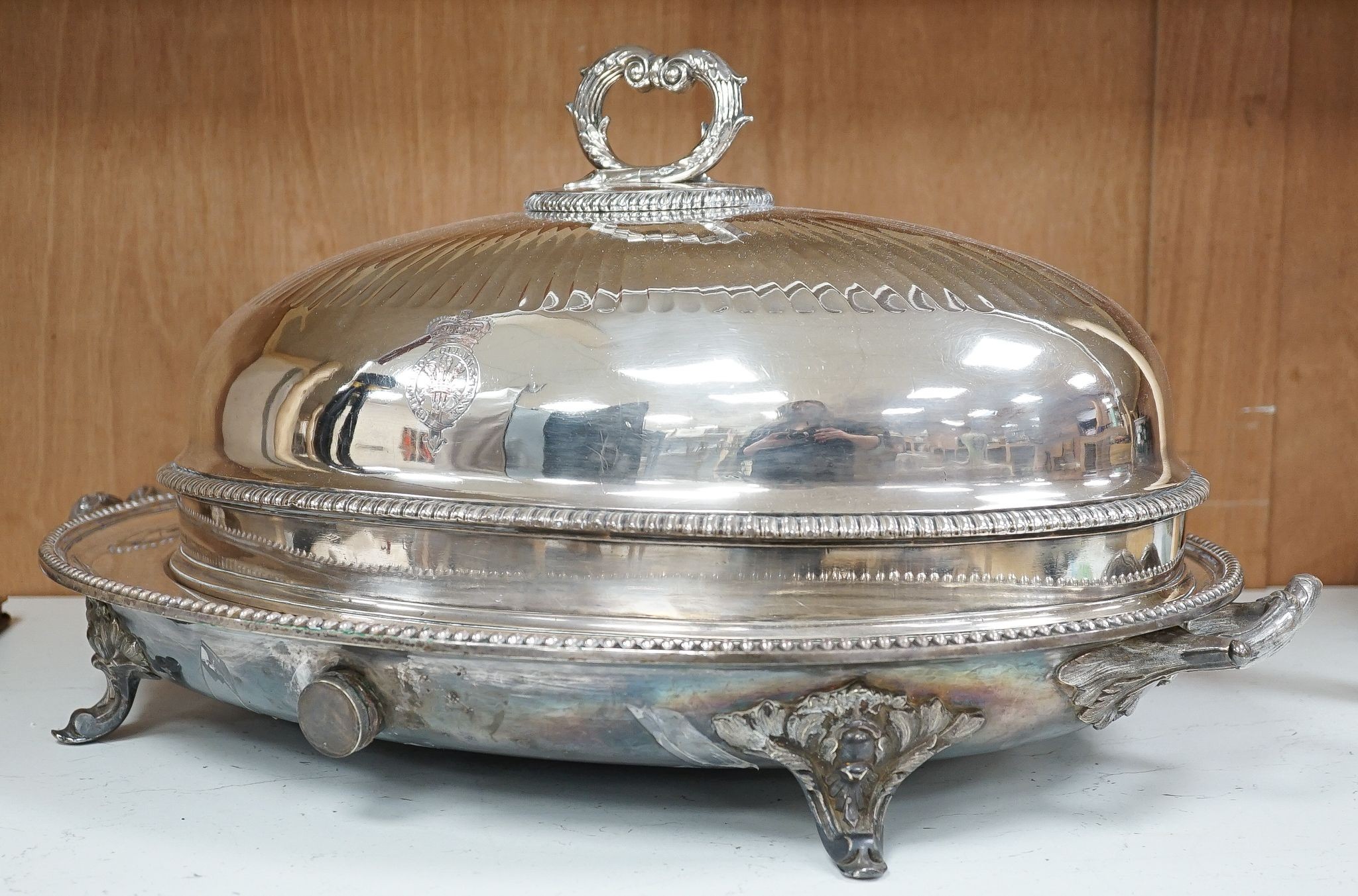 Two Victorian electroplate meat domes, and a hot water meat dish, 62 cms wide including handles.